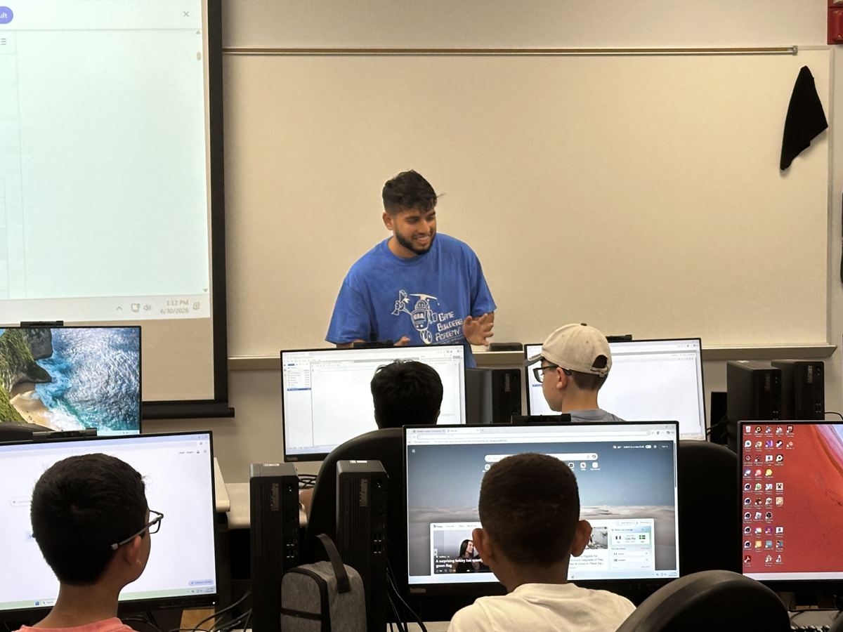Nasif teaching a computer science class, students at their workstations