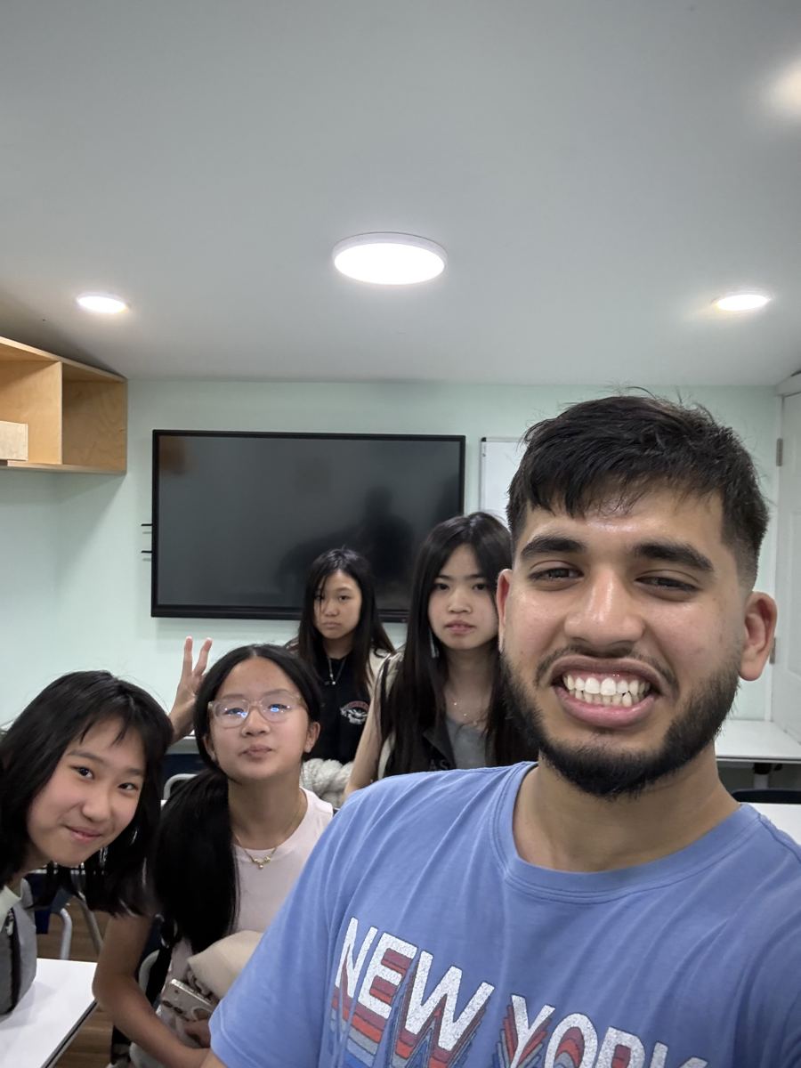 Nasif with a group of students after class